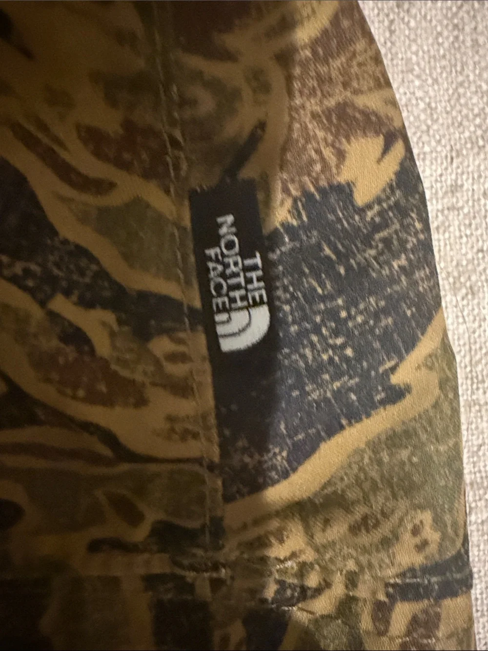The North Face Reversible Kids Gray Bucket Hat with Orange Logo and Trim